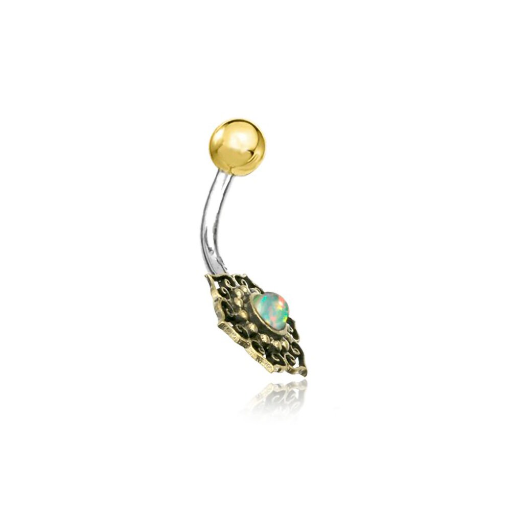 Introducing the Lutia Navel Jewelry by Kaya Movement, a boho-hippie festival accessory. This stunning piece features a curved shaft made of surgical steel and brass, adorned with a turquoise central gemstone. One end boasts a gold-tone ball, while the other end showcases an intricately textured mandala lotus design – perfect for those who love unique, handmade navel jewelry.